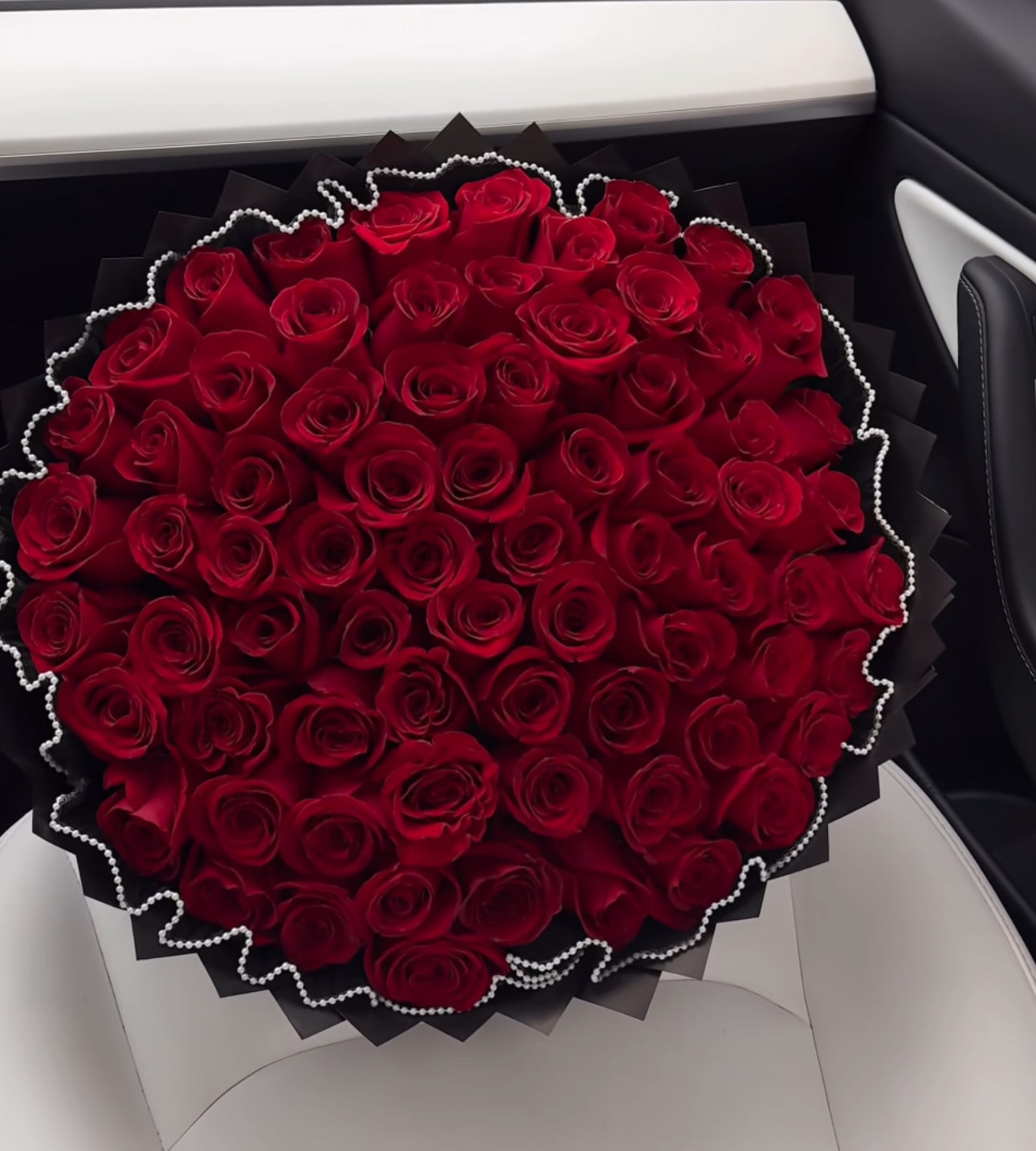 Premium 75 red rose Bouquet with Elegant black paper and pearl mesh