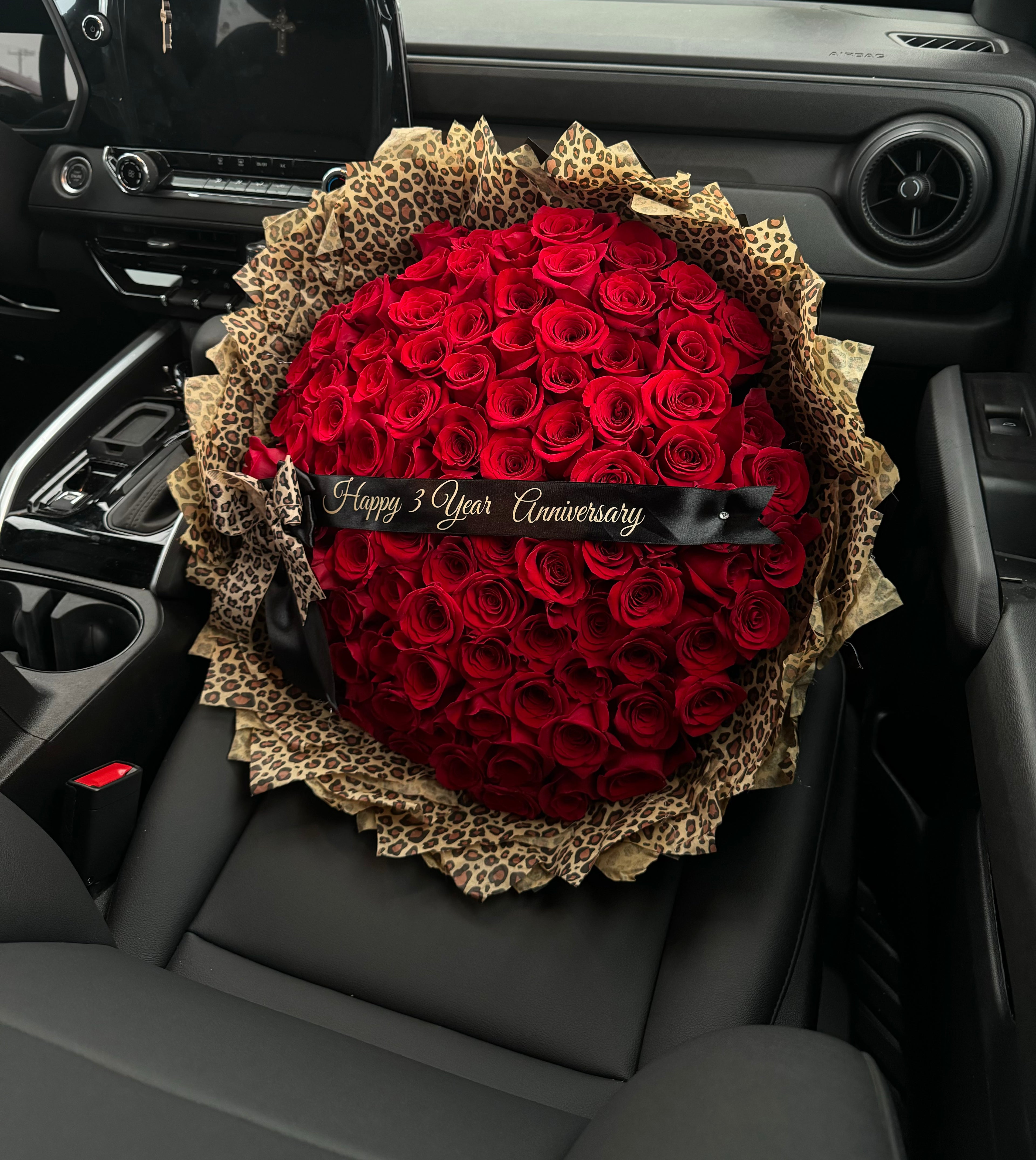 Premium 100 red rose bouquet with cheetah print paper Custom Lettering